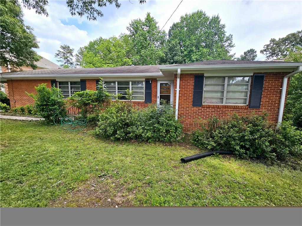 front view of a house with a yard