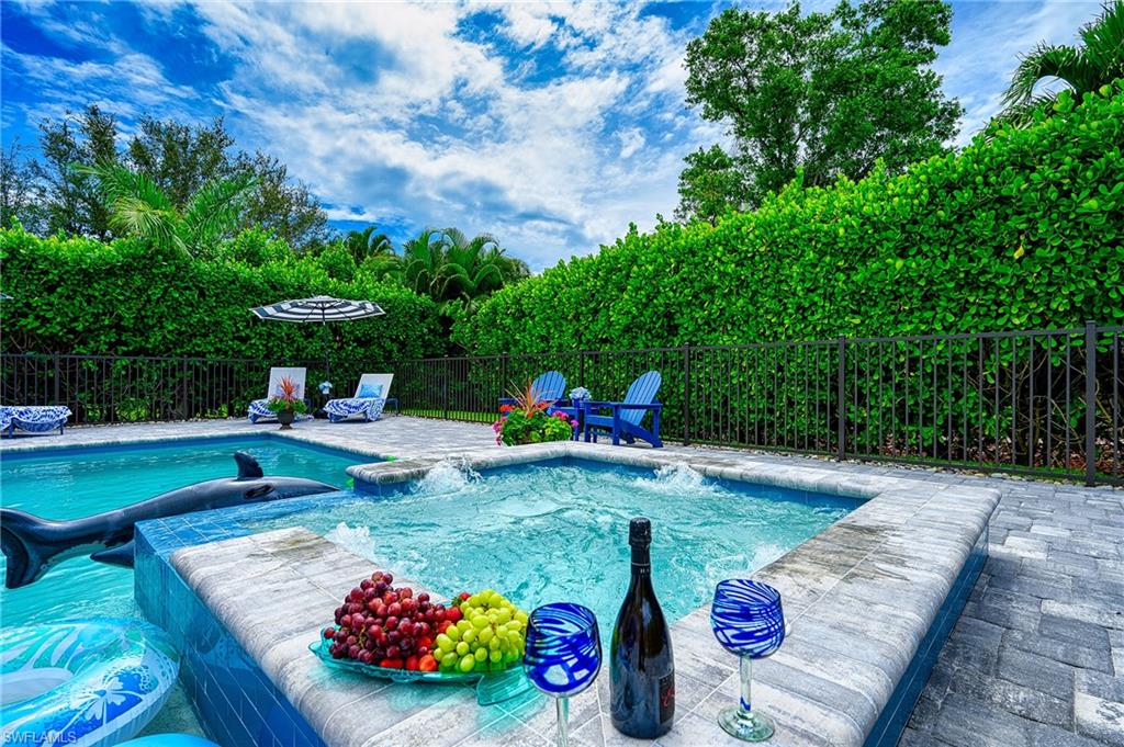 a view of a backyard with sitting area