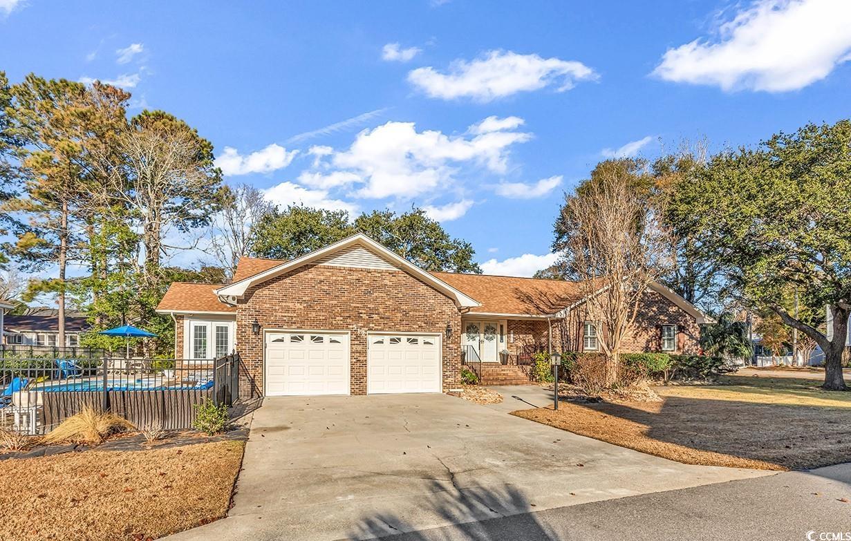 Single story home featuring a garage