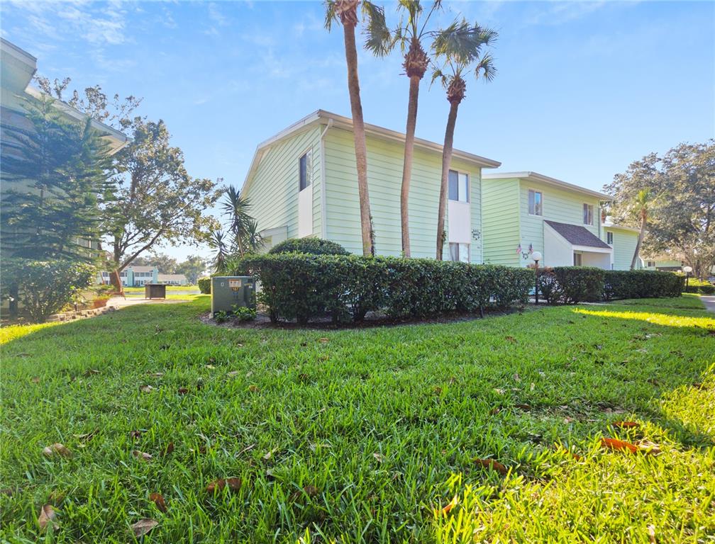 a view of a house with a backyard