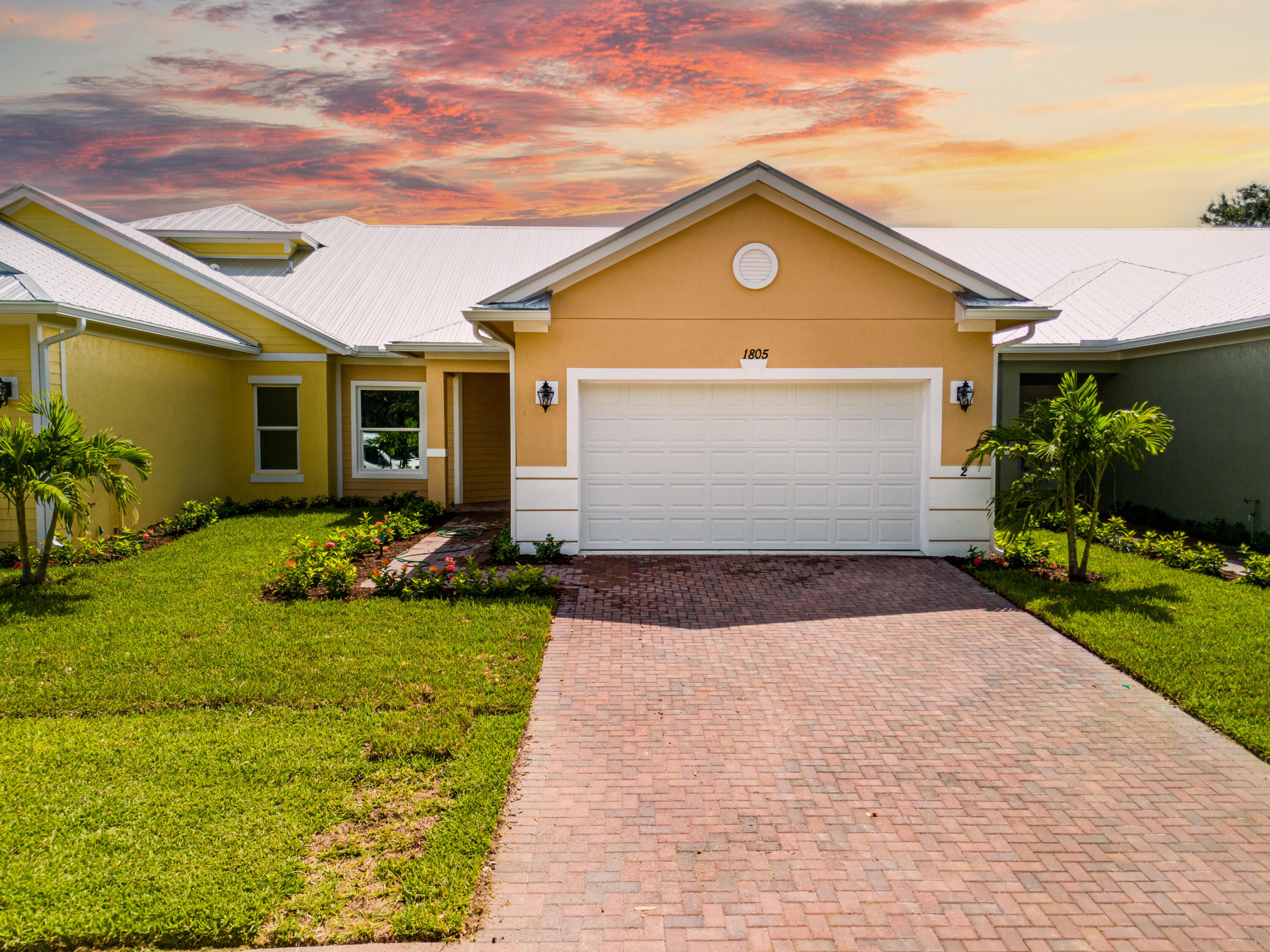 a front view of house with yard and green space