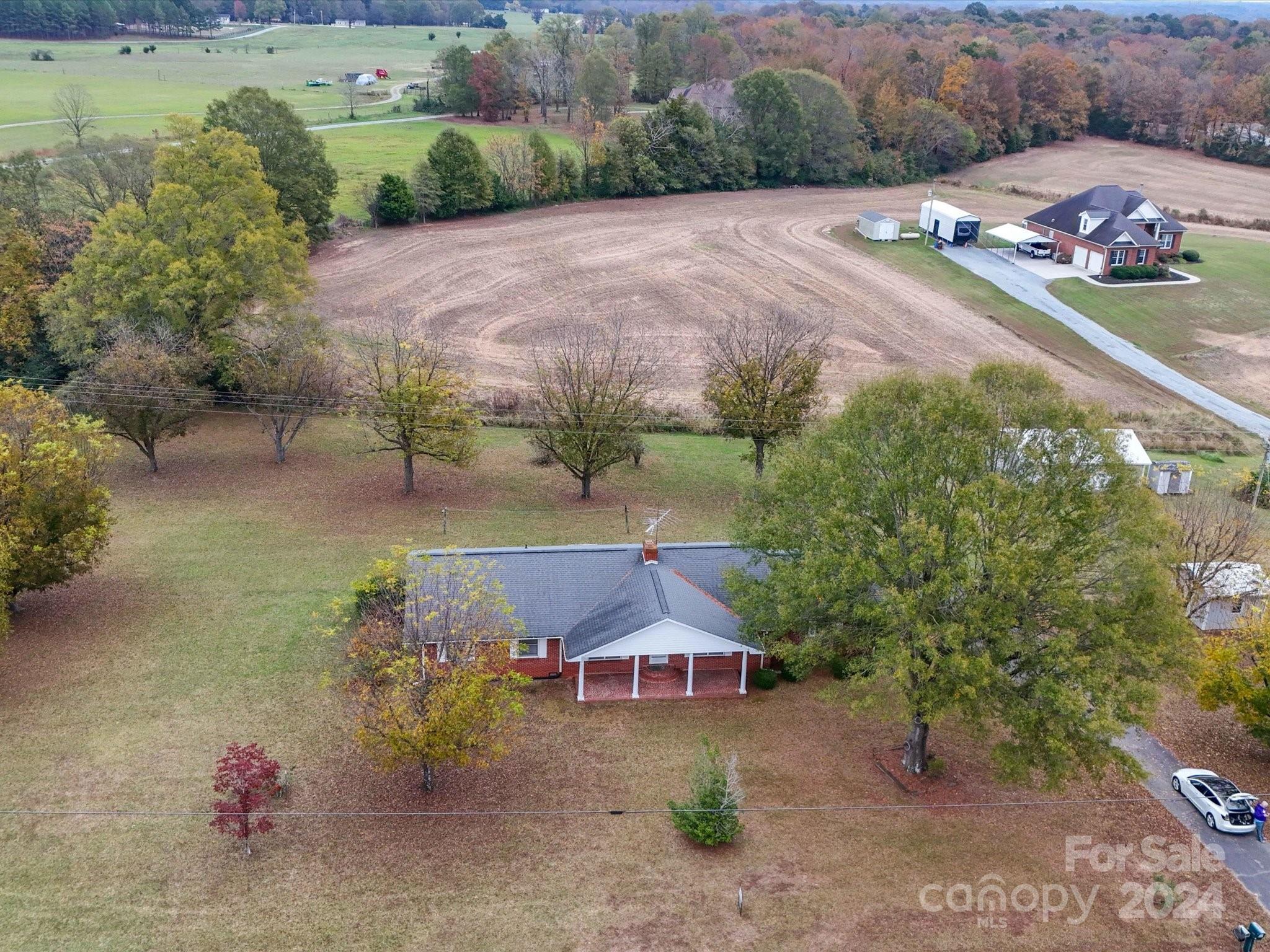 an aerial view of a house with a garden