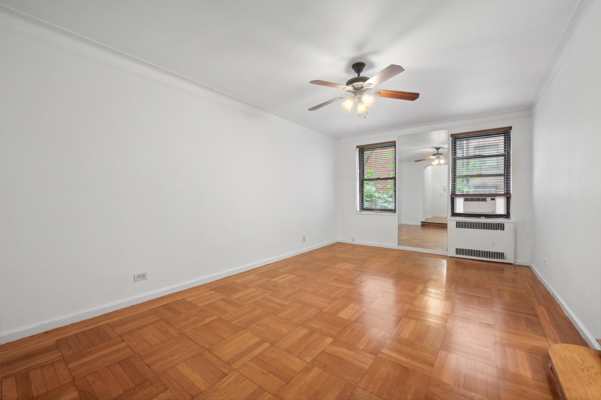 a view of an empty room with a window