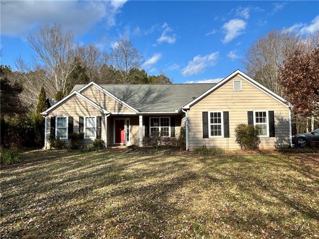 a front view of a house with a yard