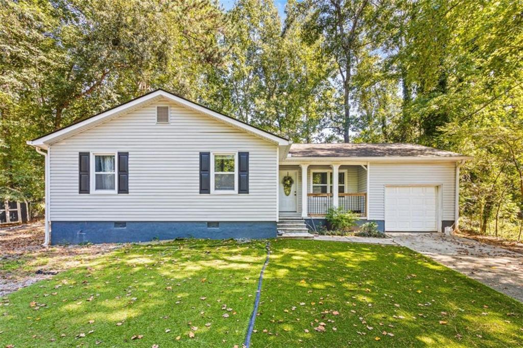 a front view of house with yard outdoor seating and yard