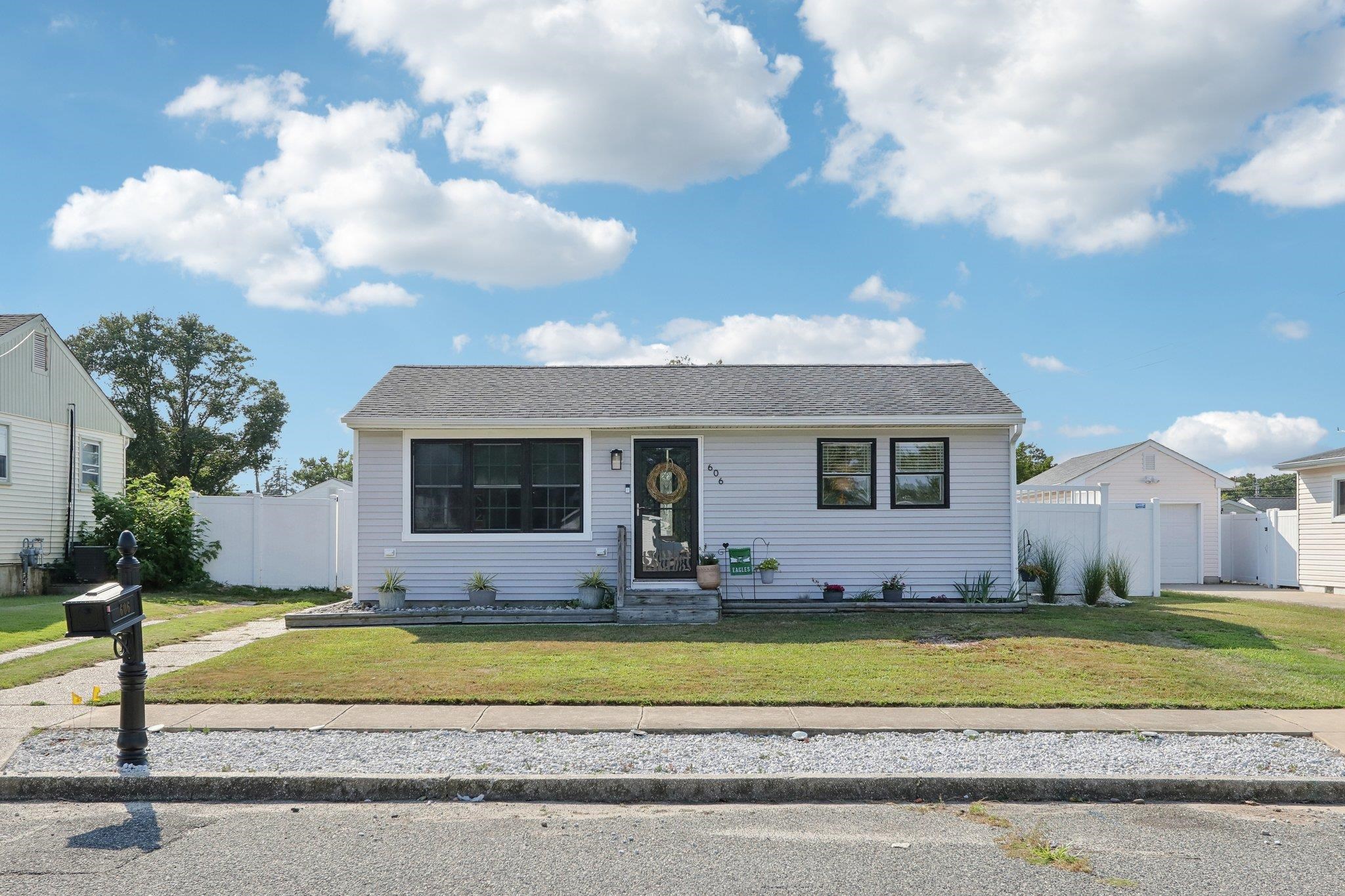 a view of house with yard and entertaining space