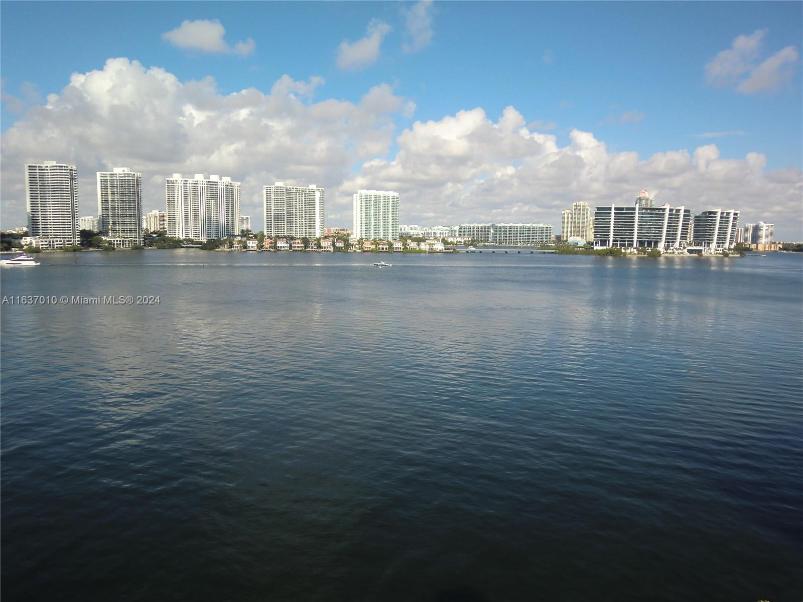 a view of building with lake view and bridge