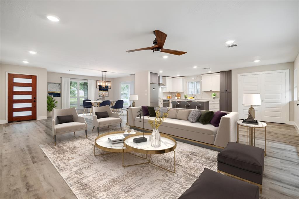 a living room with furniture and a wooden floor