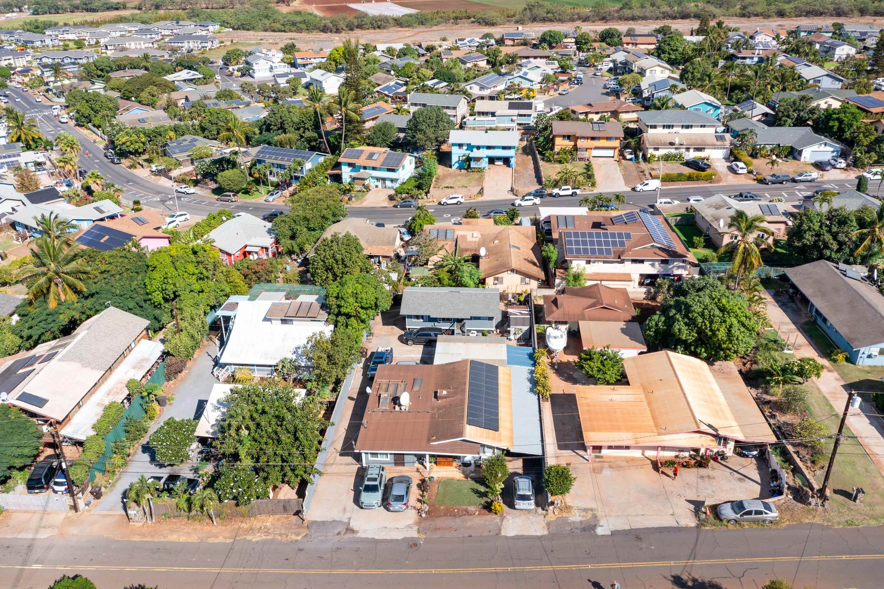 an aerial view of residential houses with outdoor space