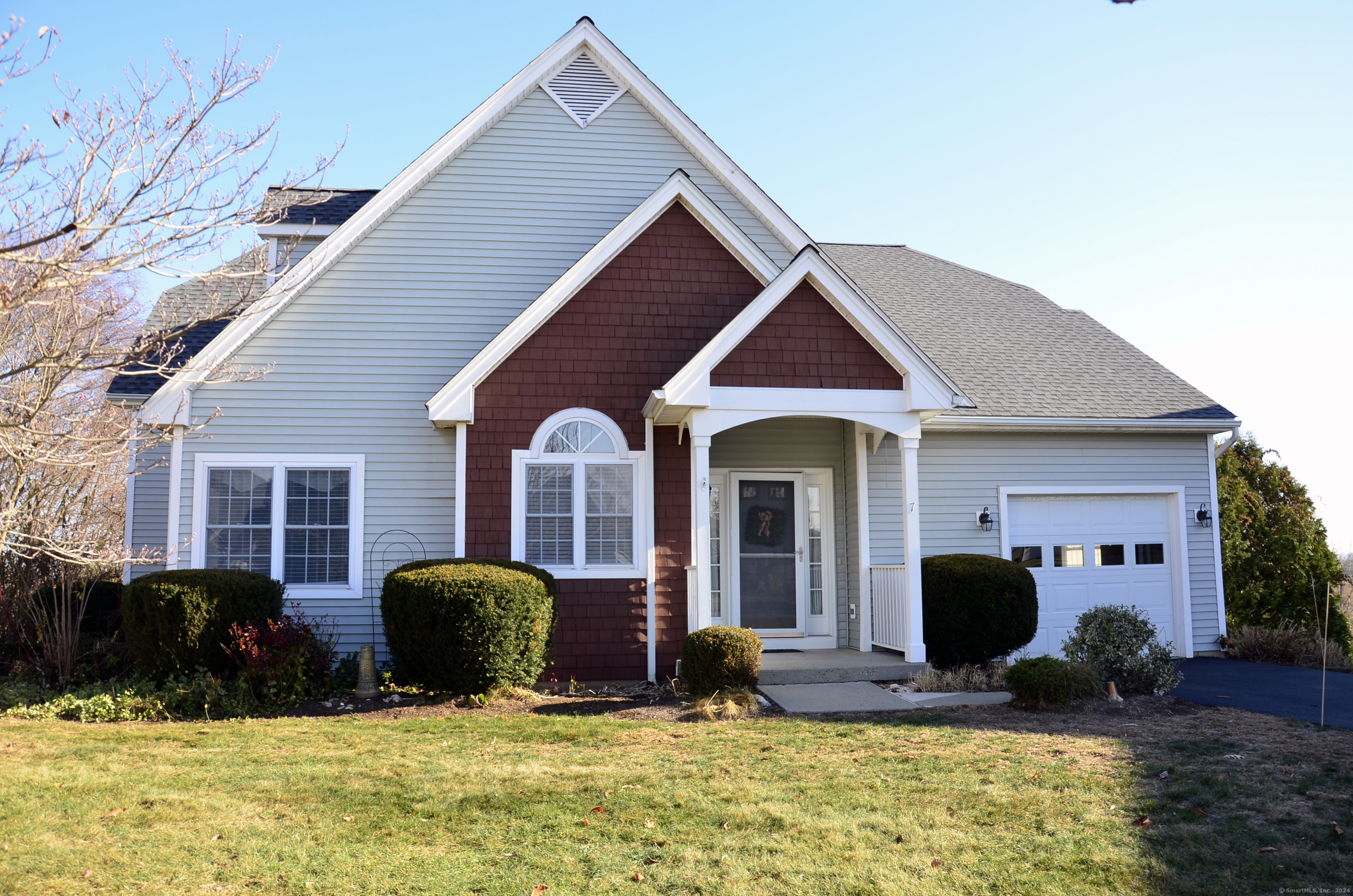 a front view of house with yard outdoor seating and barbeque oven