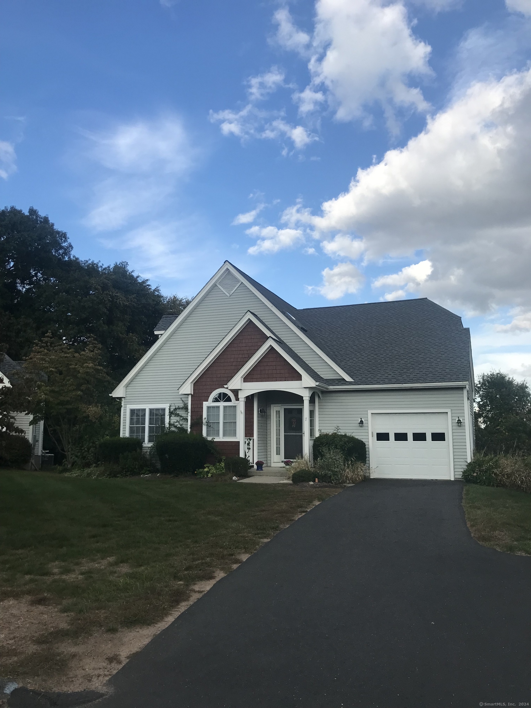 a view of a house with a yard