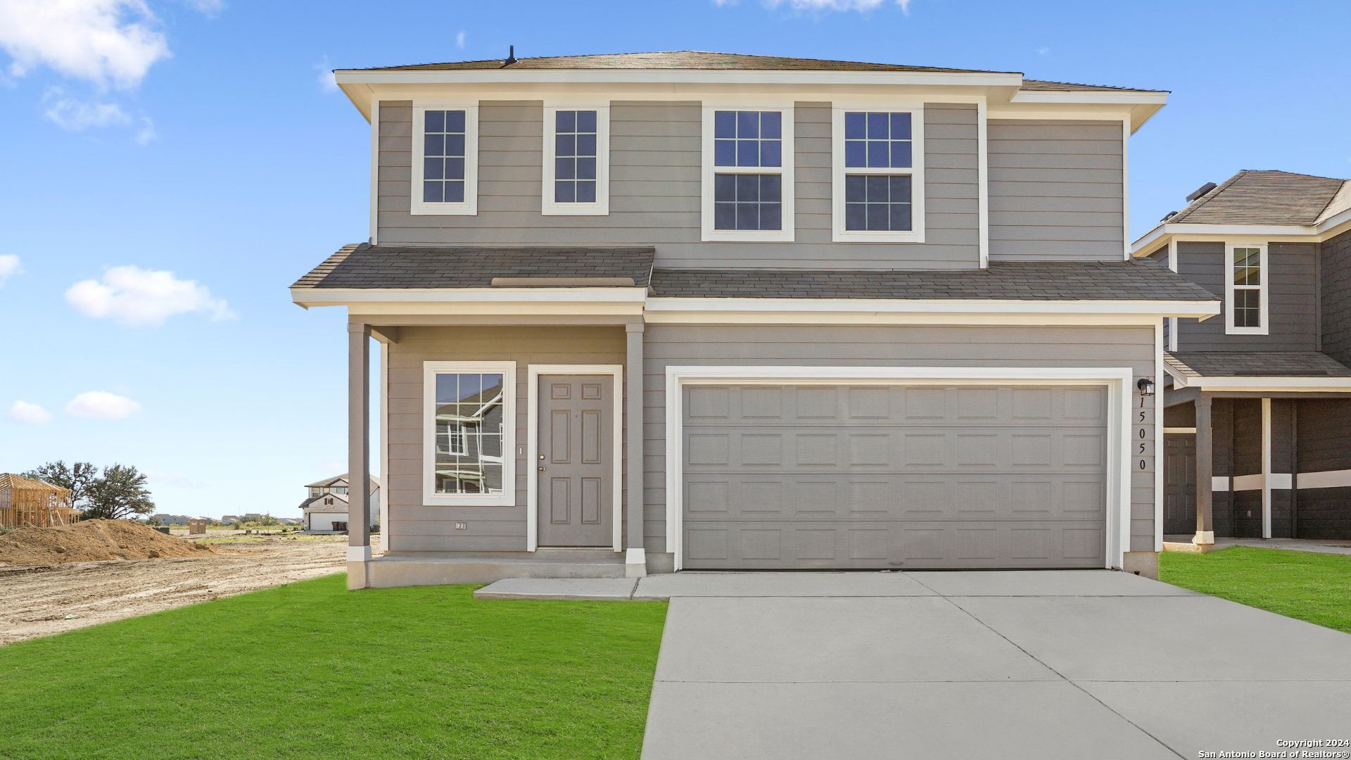 front view of a house with a yard