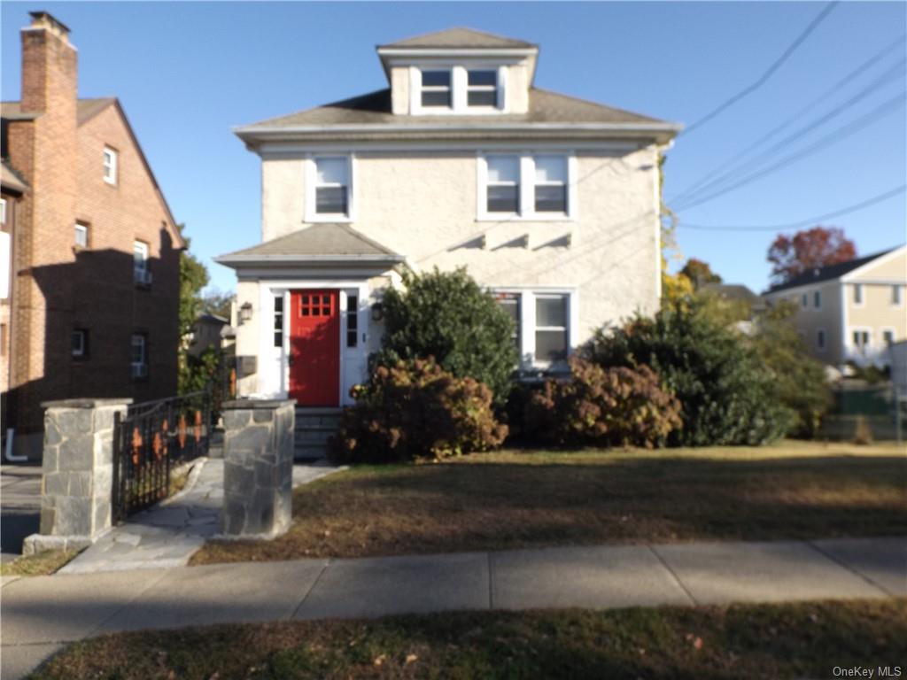 a front view of a house with yard