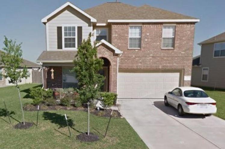 a car parked in front of a house