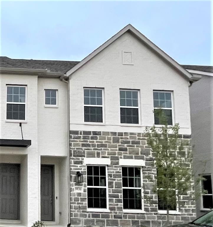 a front view of a house with large windows