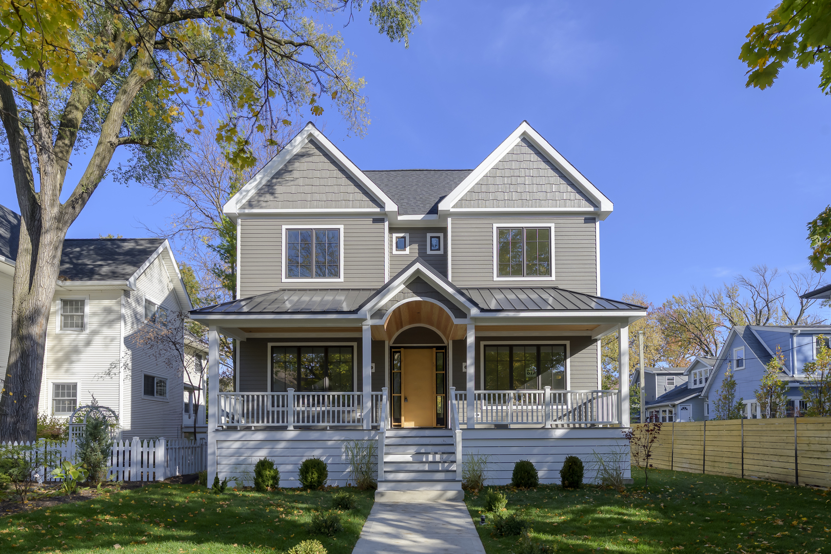 a front view of house with yard and green space