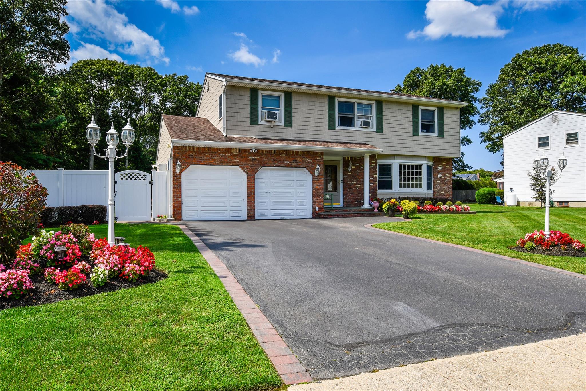 a front view of house with yard and green space