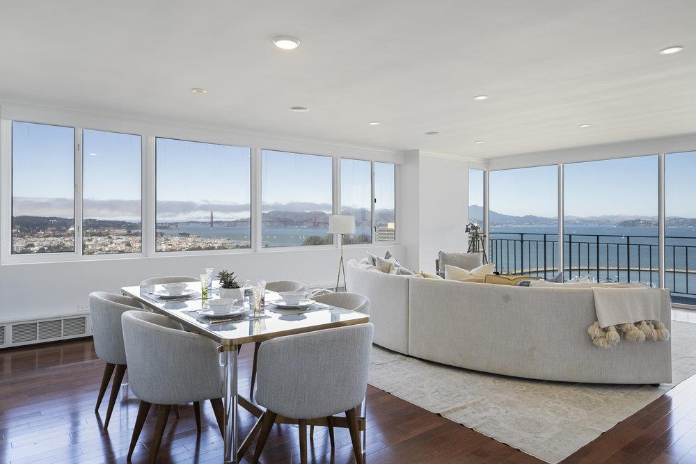 a dining room with furniture window and wooden floor