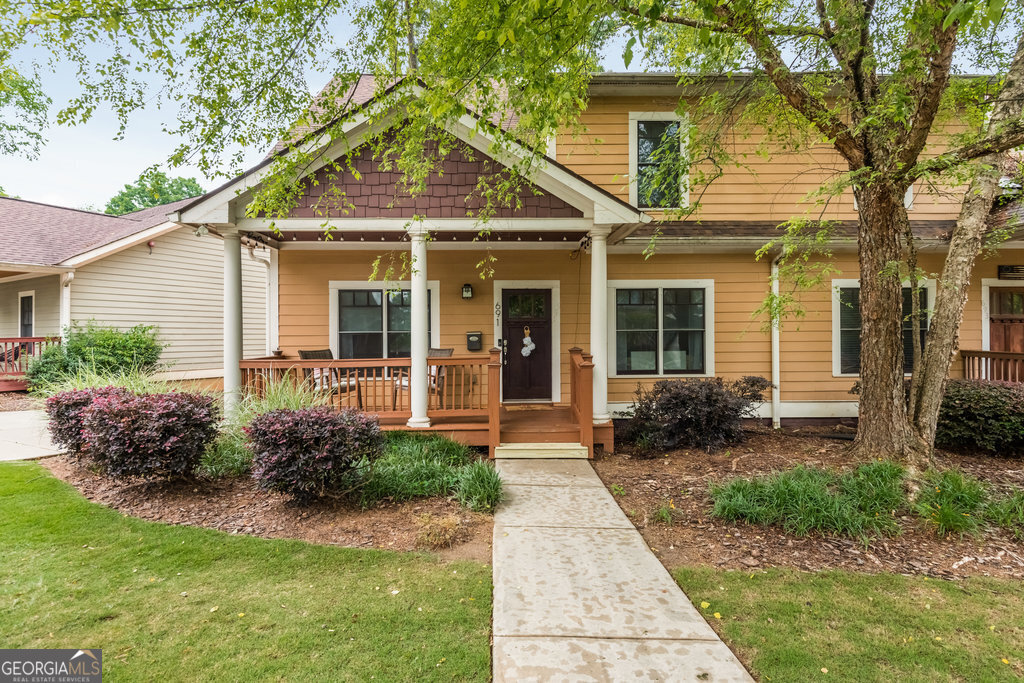 a front view of a house with garden