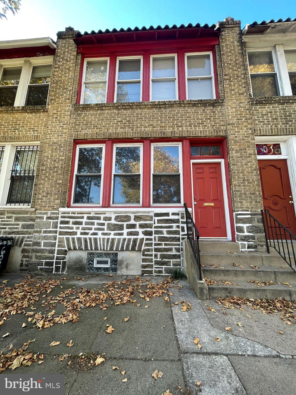 a front view of a house with glass windows