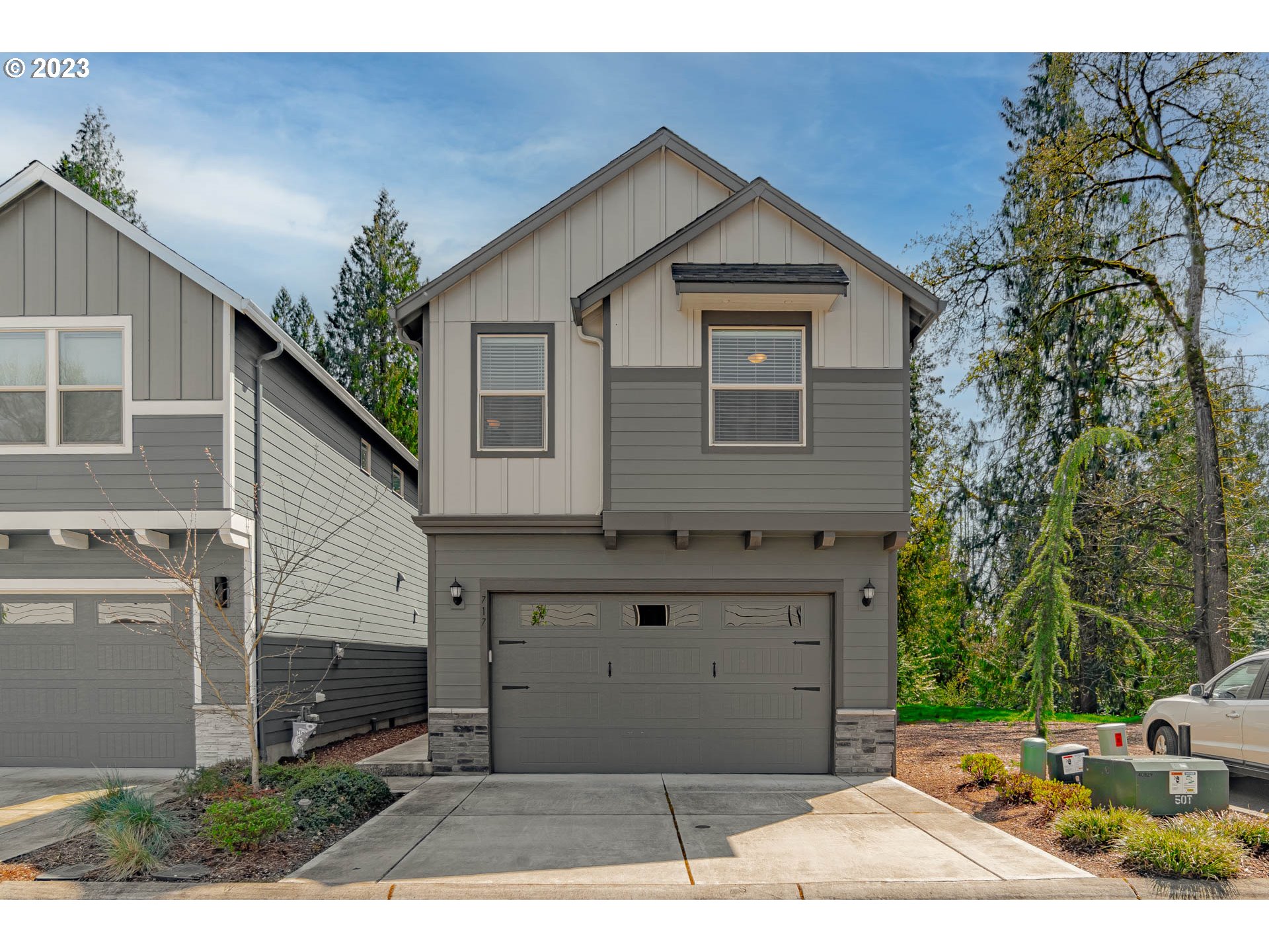 a front view of a house with garage