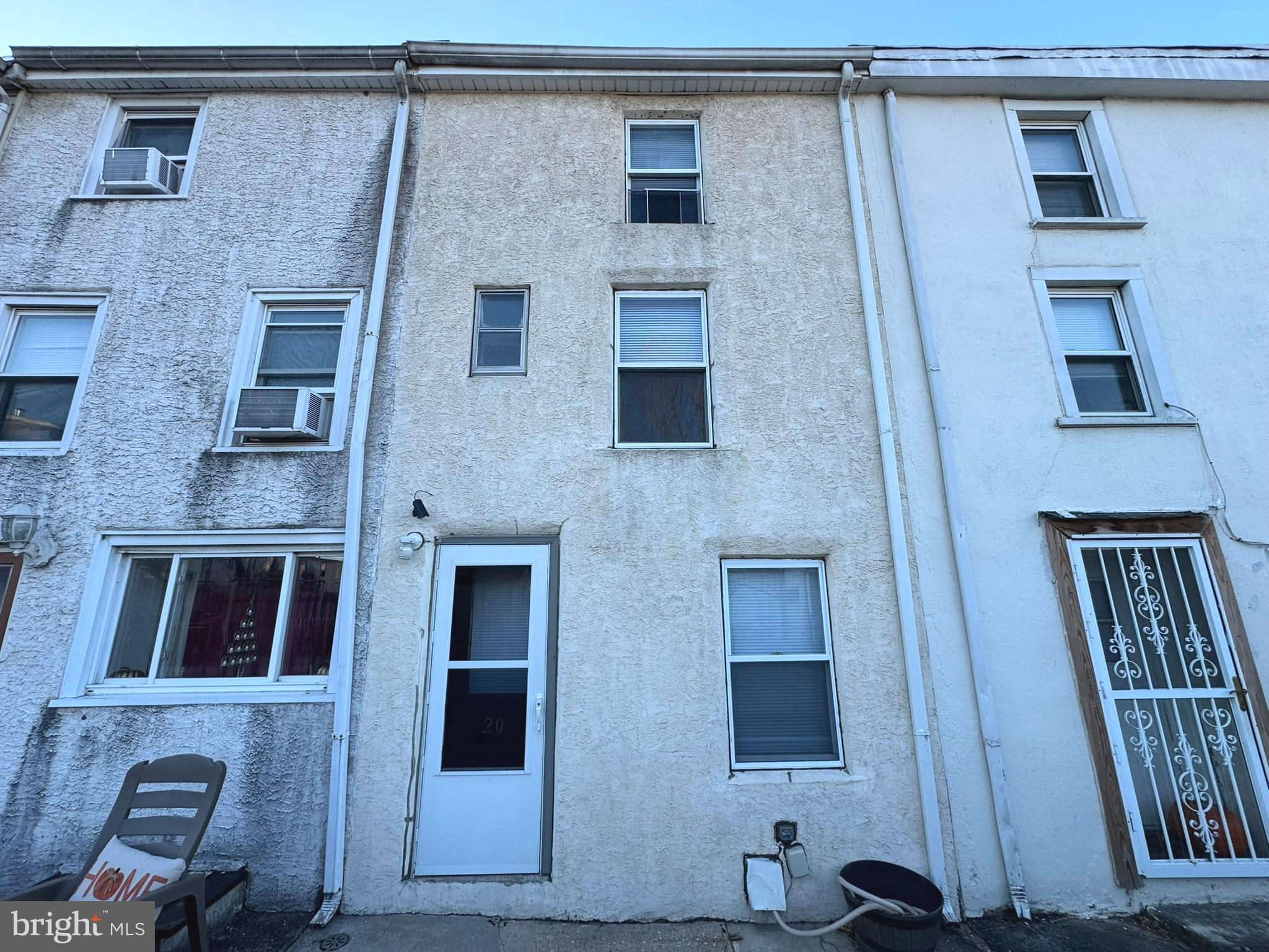 a front view of a house with many windows