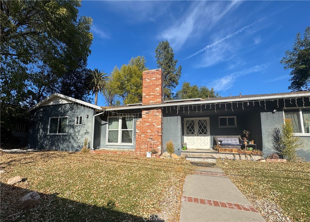 front view of a house with a patio