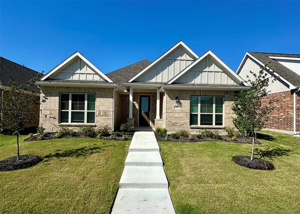 a front view of a house with yard