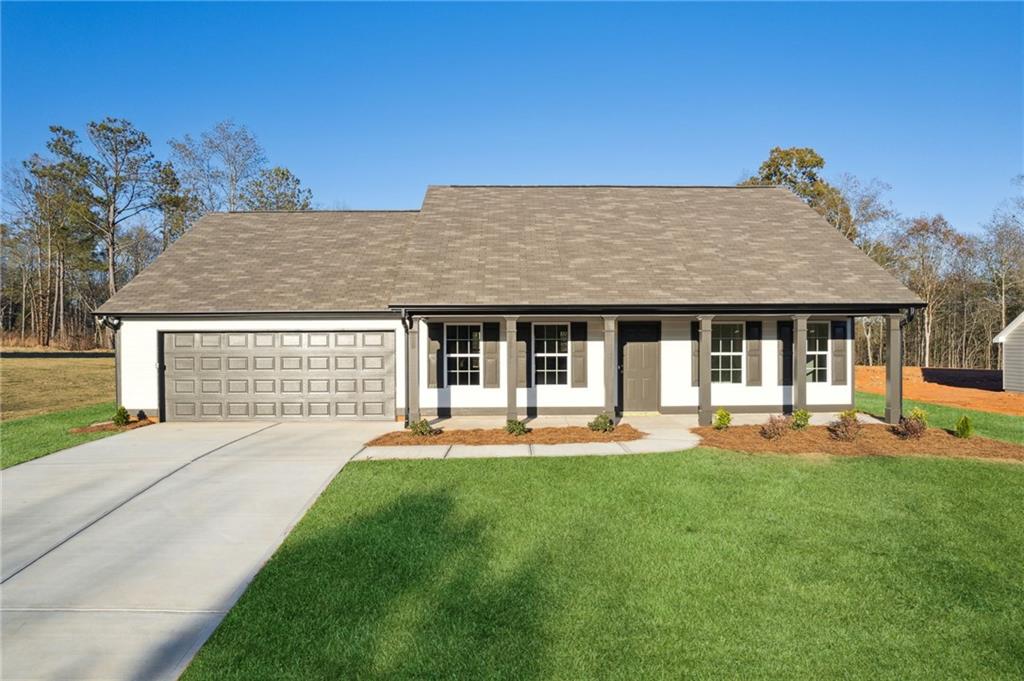 front view of a house with a yard