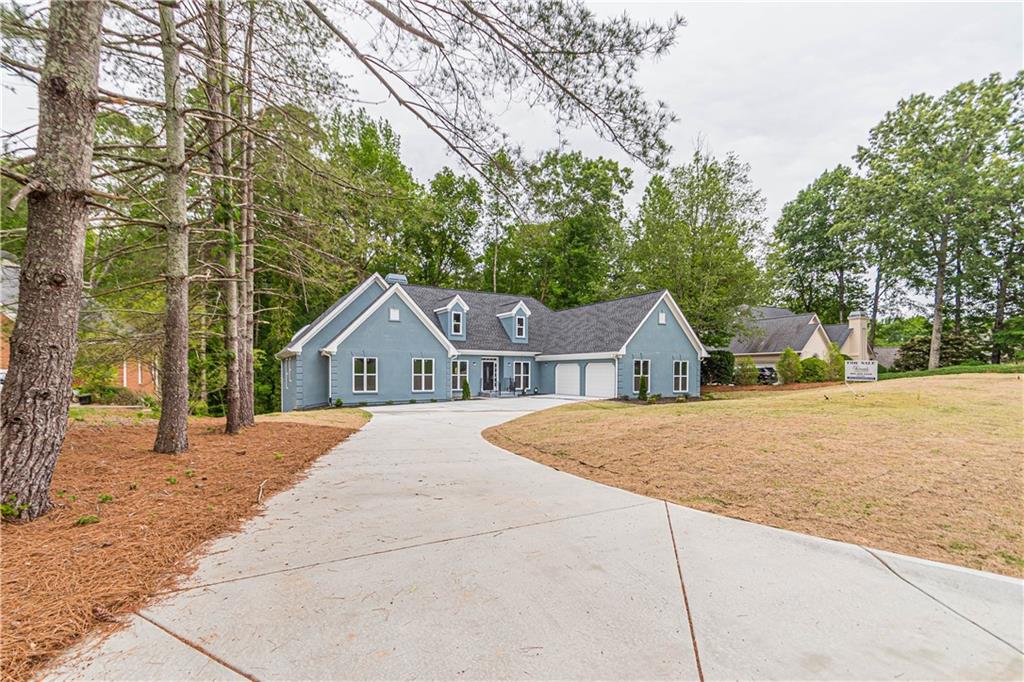 a house with trees in the background