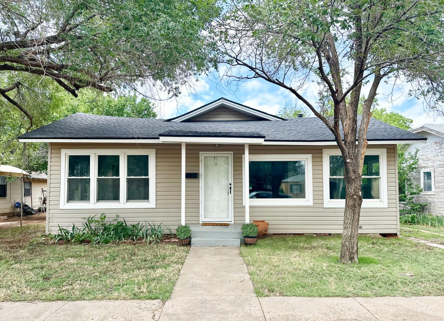 front view of a house with a yard