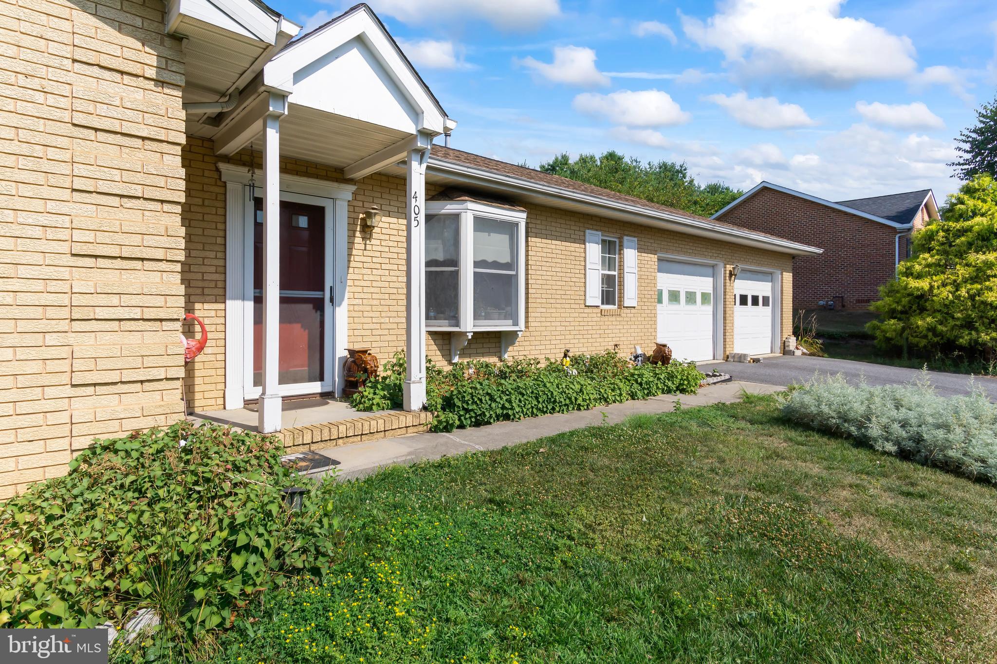 front view of a house with a yard