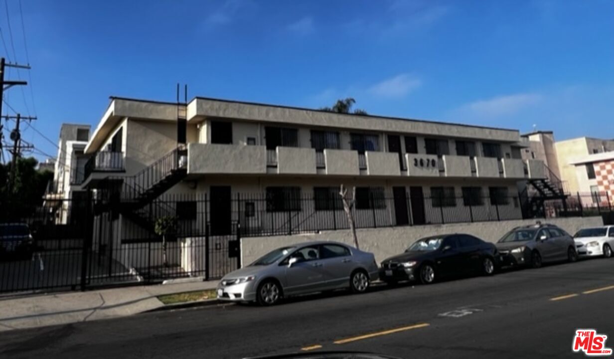 a view of a car parked in front of a building