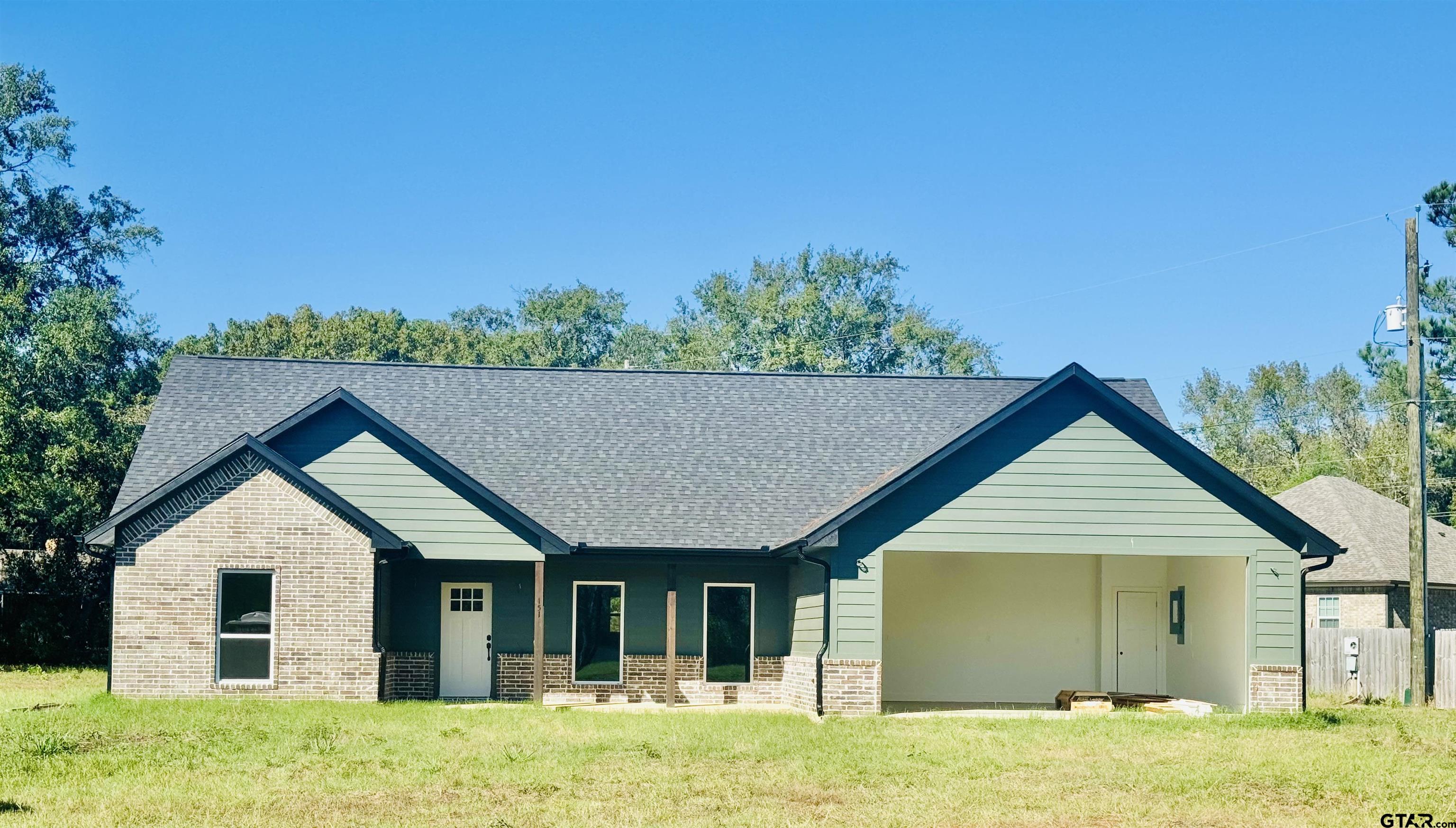 front view of a house with a yard