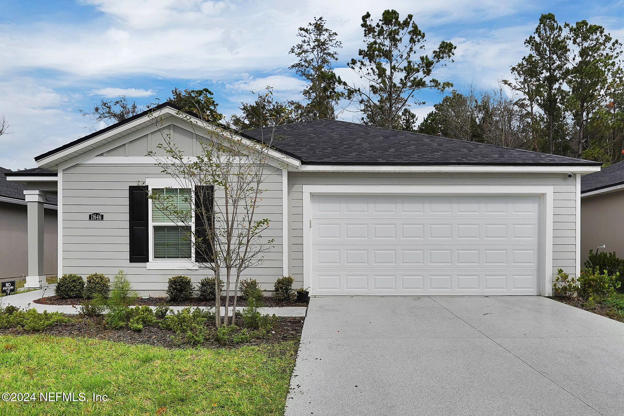 front view of a house with a yard