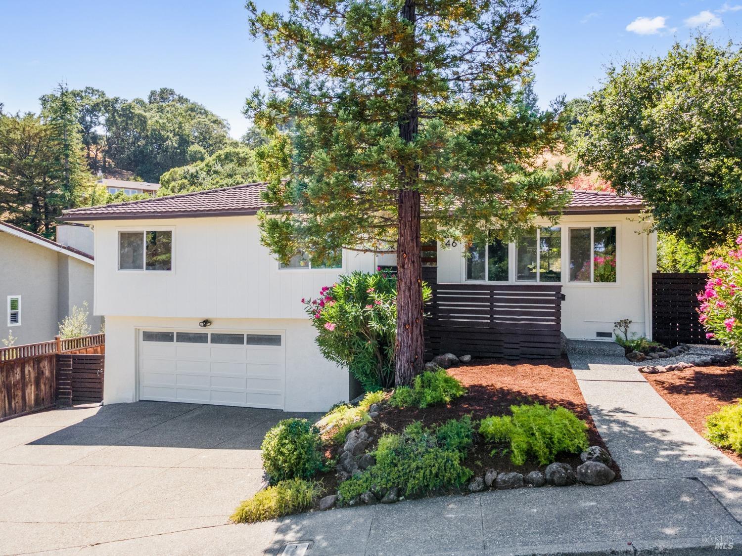 Welcome home to this updated Mid-Century bi-level home. So much to like here - from the great curb appeal, functional updated interior, to the large private lot.