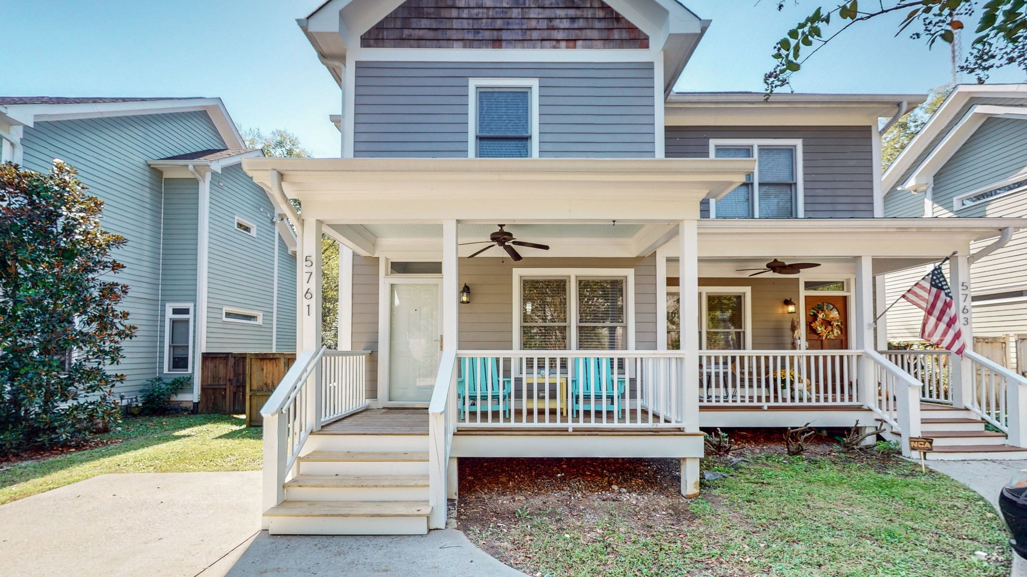 a view of front door of house with a deck