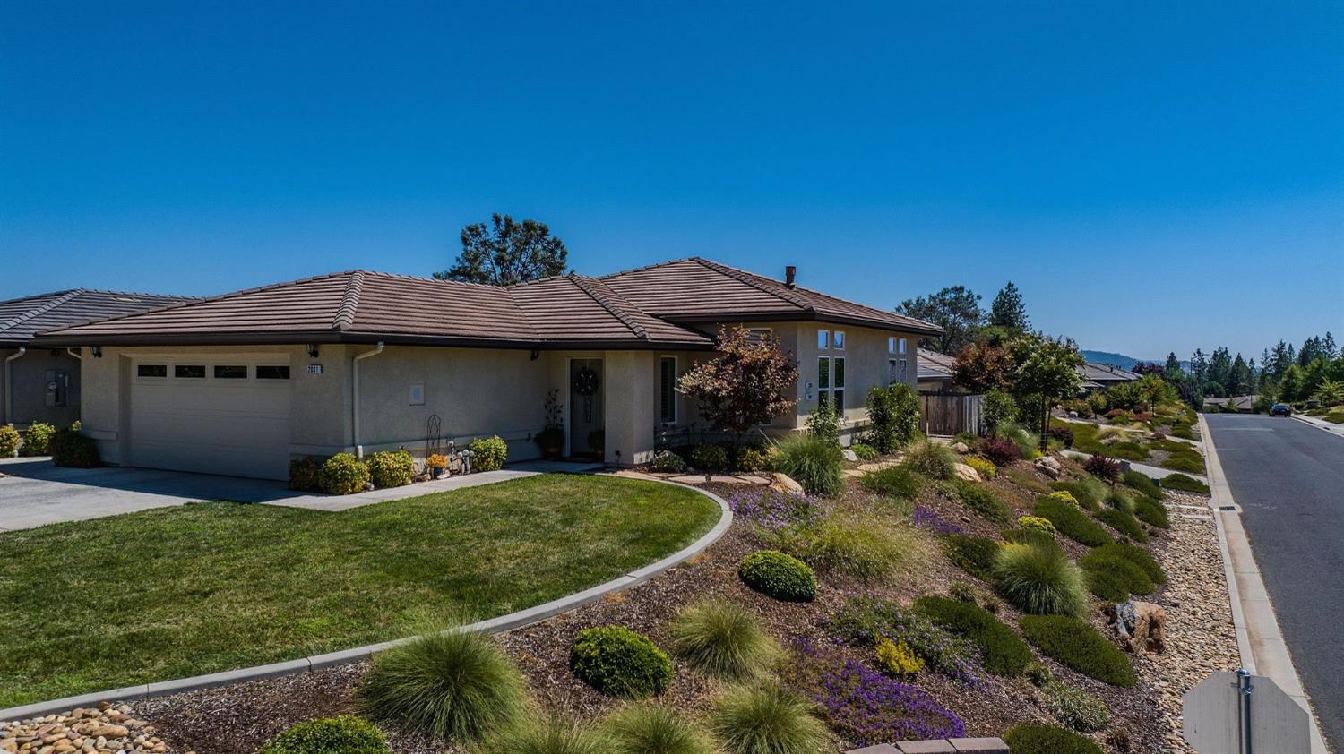 a front view of a house with garden