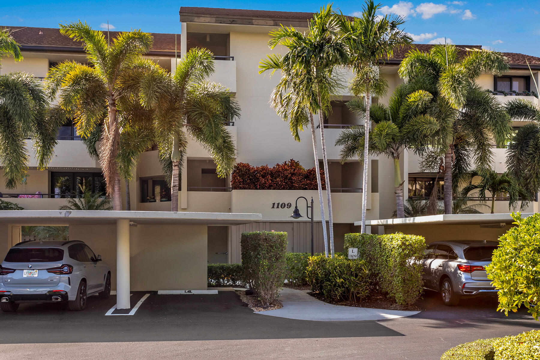 a view of a cars park in front of a house