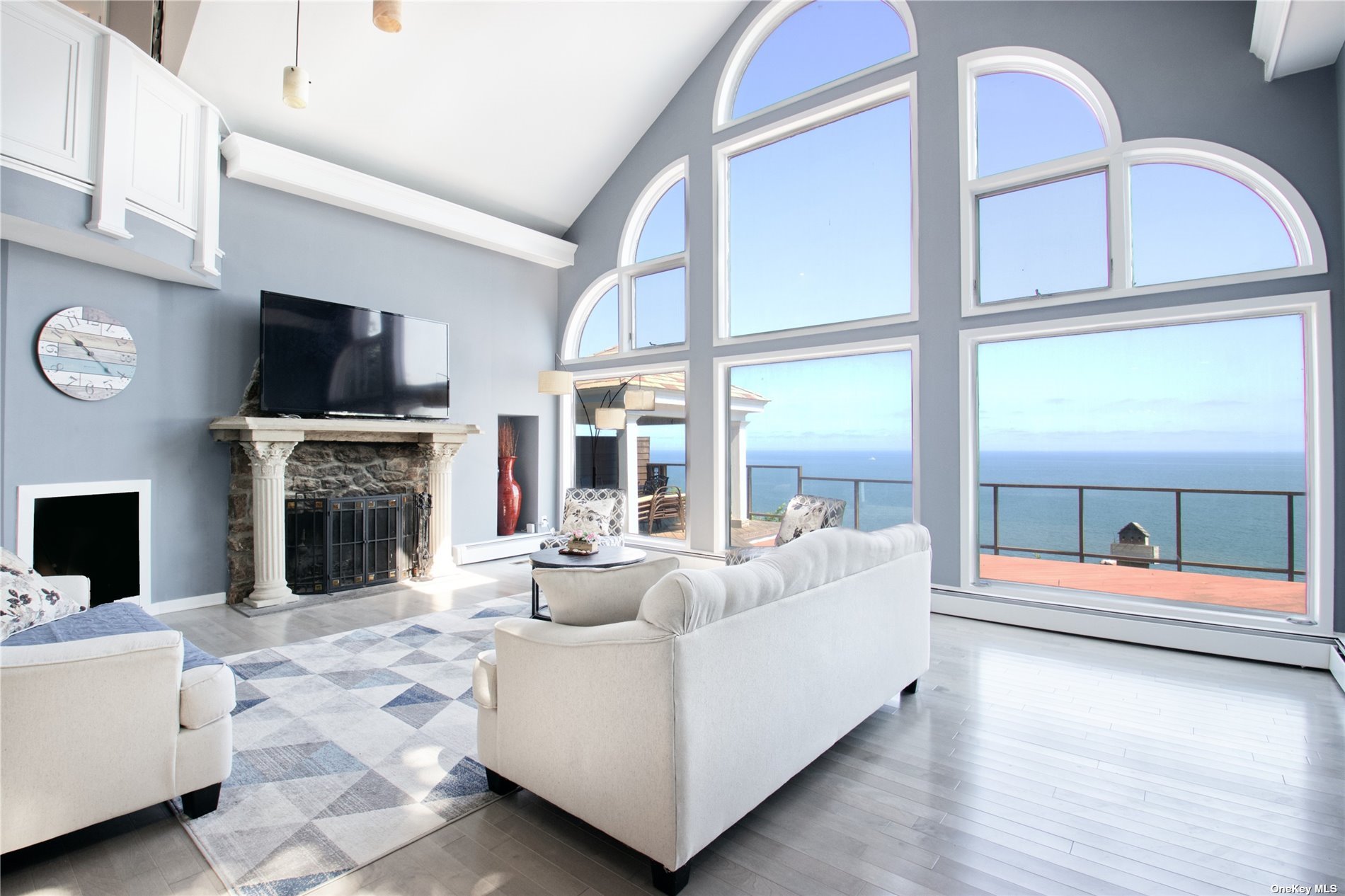 a living room with fireplace furniture and a flat screen tv