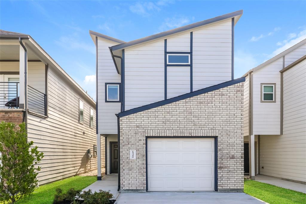 a front view of a house with garage