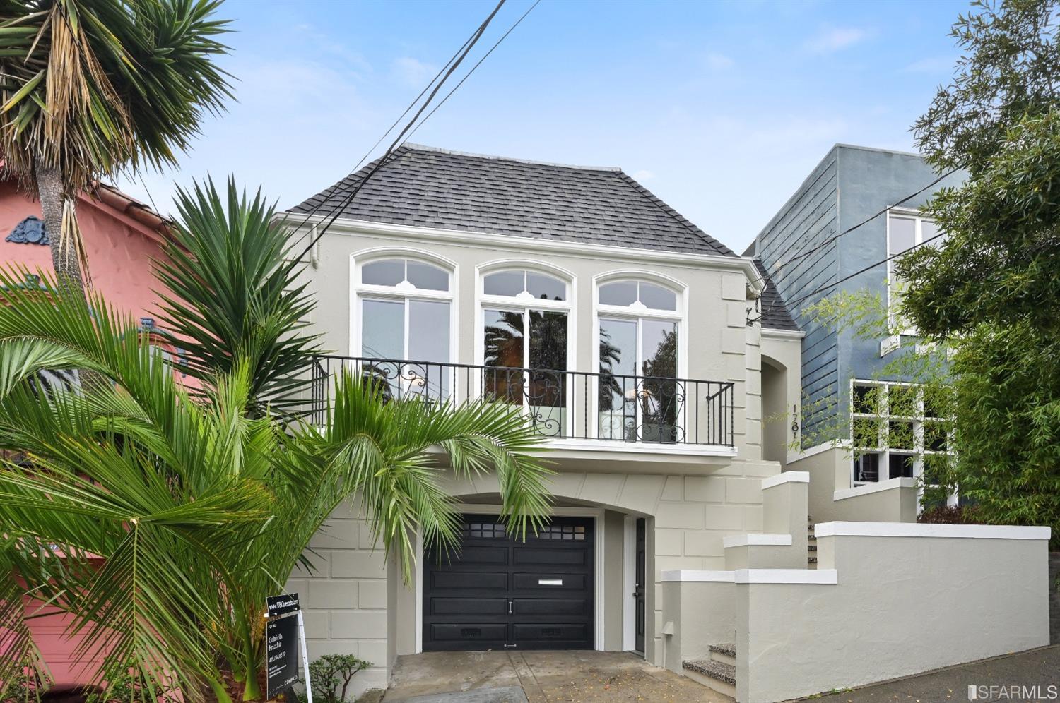 a front view of house with small garden