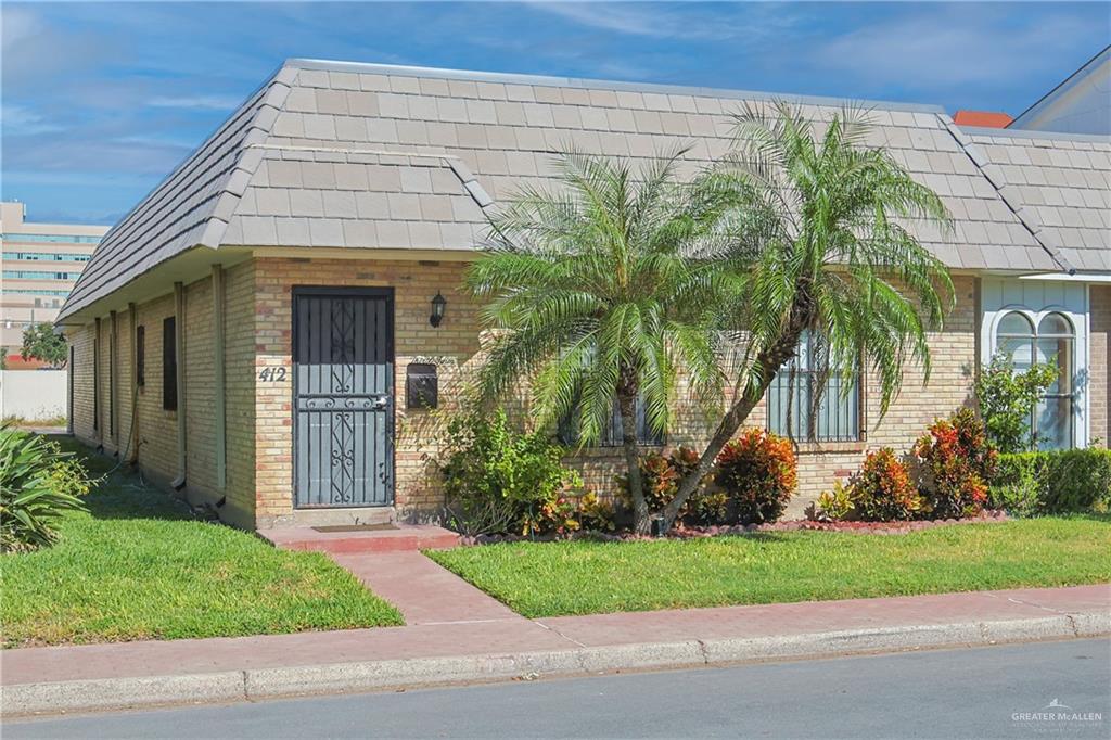 View of front of property with a front lawn