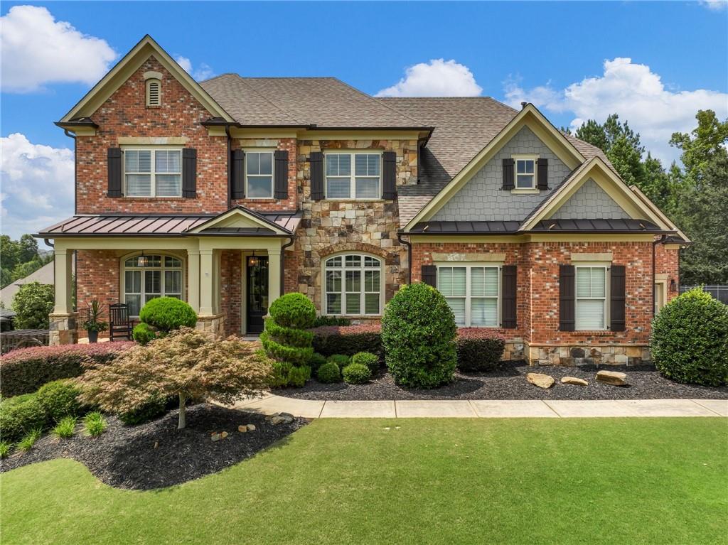 a front view of a house with a yard