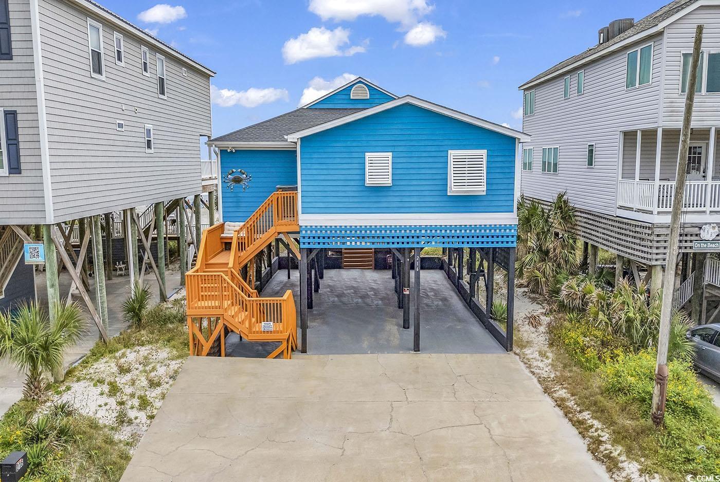 View of patio with a carport