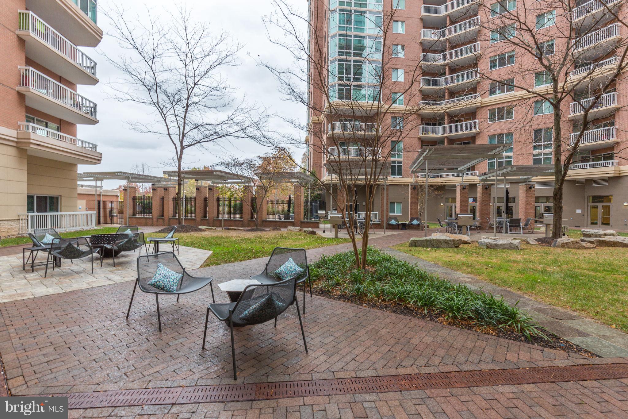 a swimming pool with outdoor seating and yard