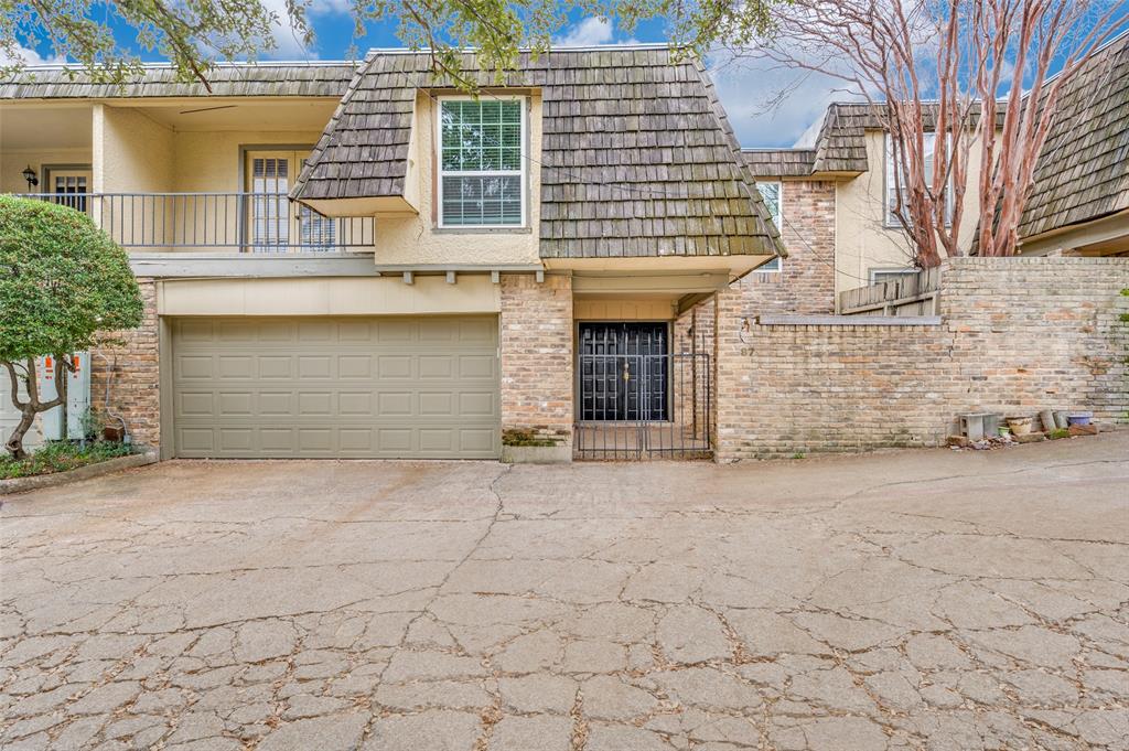 a front view of a house with a garage