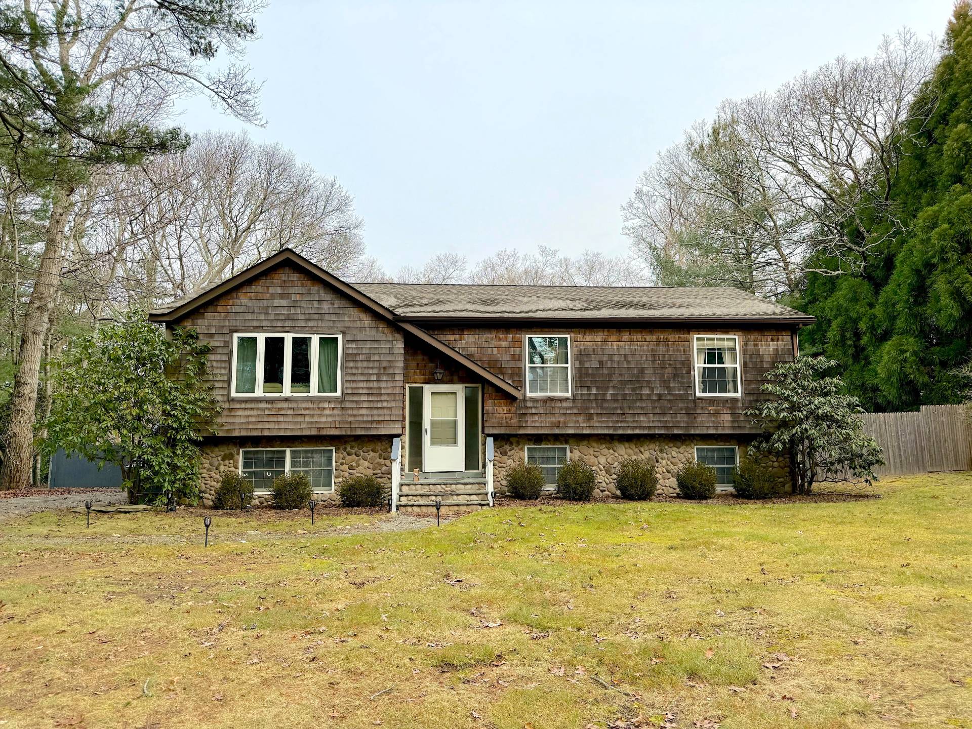 a front view of a house with a yard