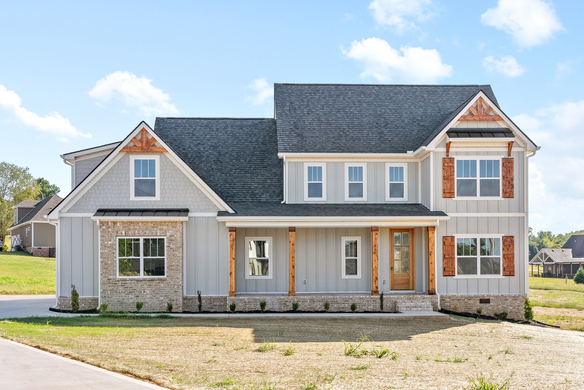 a front view of a house with a yard