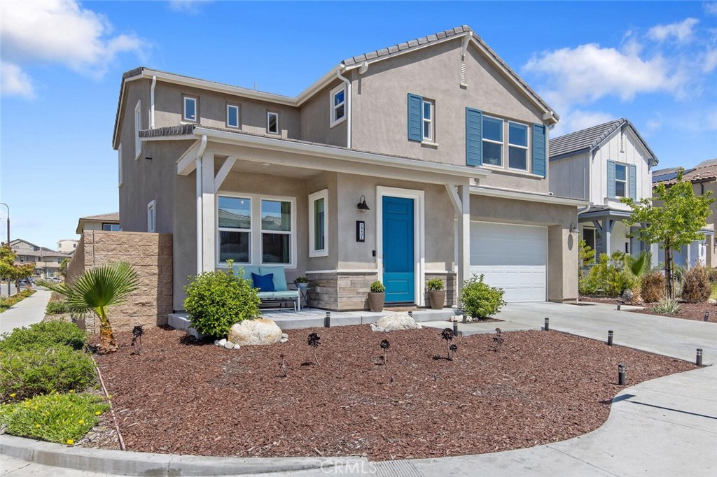 a front view of a house with garden